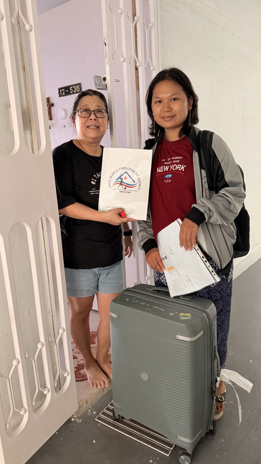 A helper arriving at the employer's home with Jans Maid & Employment Agency paperwork